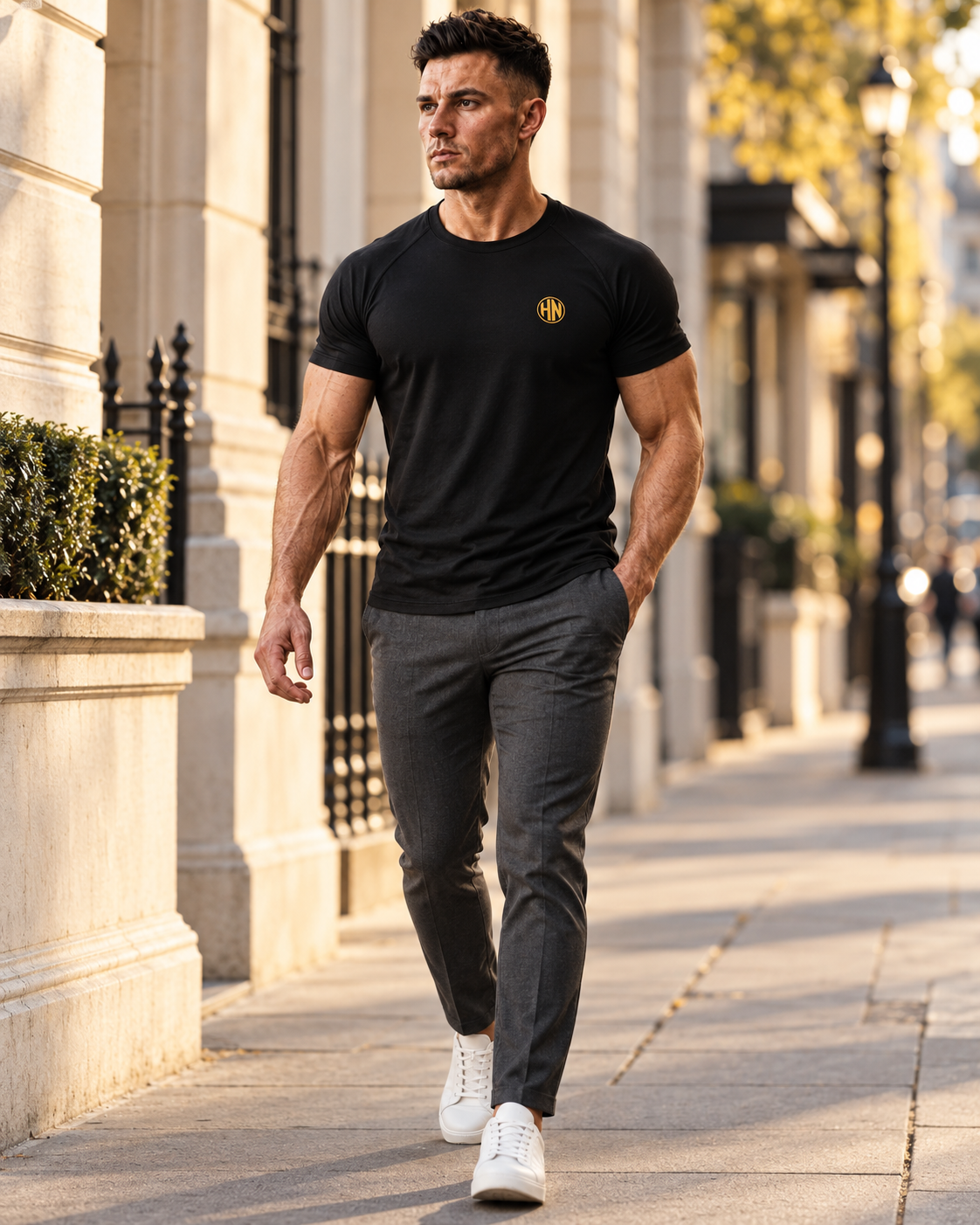 Model walking outdoors in a black Hack Pro Essential T-shirt